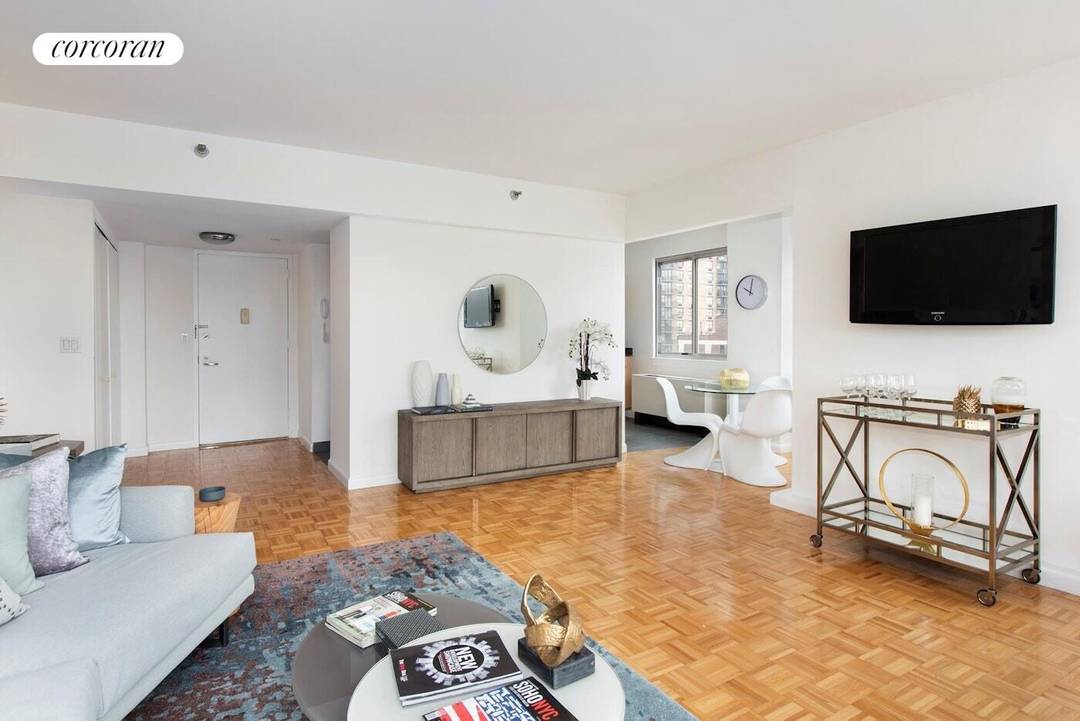 This two bedroom, two bath home has an expansive living and dining room with views of the East River, lower Manhattan and Empire State Building.
