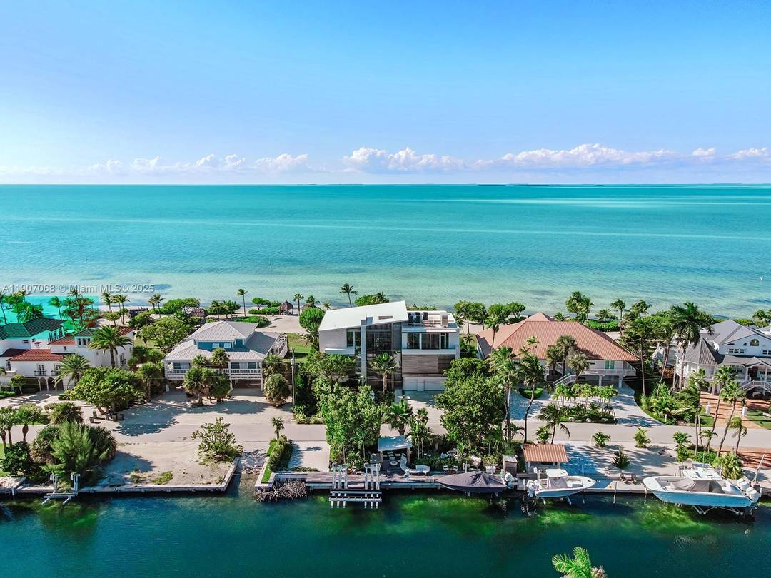 A rare architectural masterpiece by renowned architect Max Strang, this modern coastal estate in Port Antigua, Islamorada, redefines luxury waterfront living.