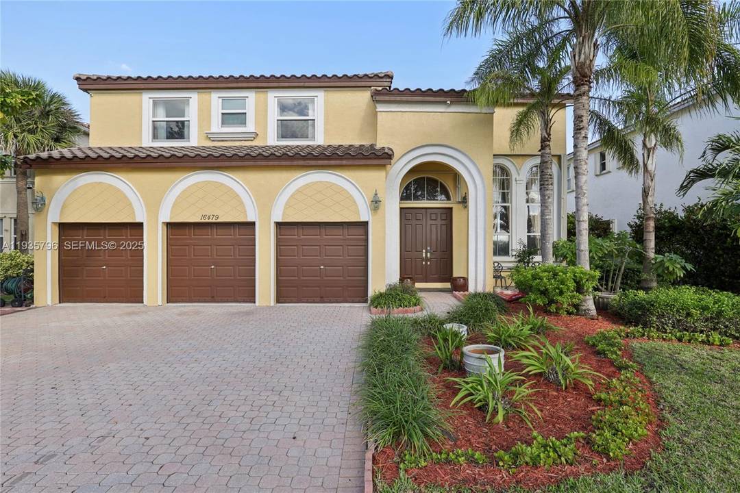 Beautiful two story single family residence located in the highly desirable, gated community of Riviera Isles II in West Miramar.