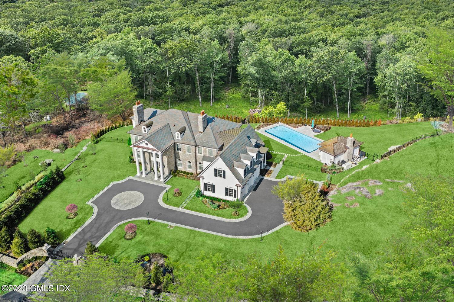 Extraordinary custom six bedroom Stone Cedar home graces 2.