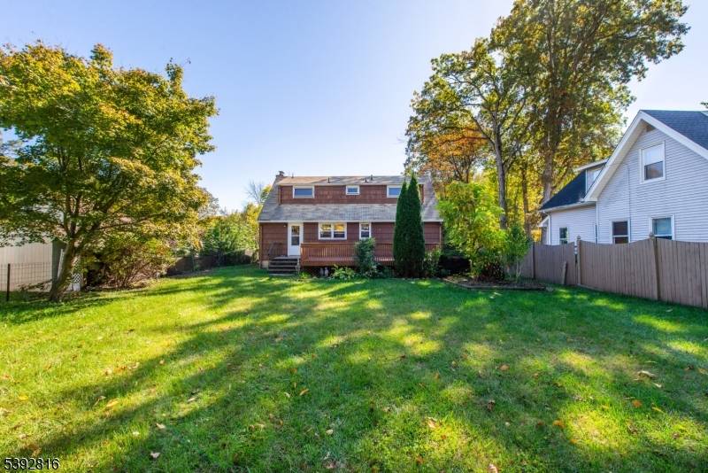 Welcome to 5 Seminole Trail, a charming Cape Cod style home nestled in the sought after Indian Lake community of Denville.