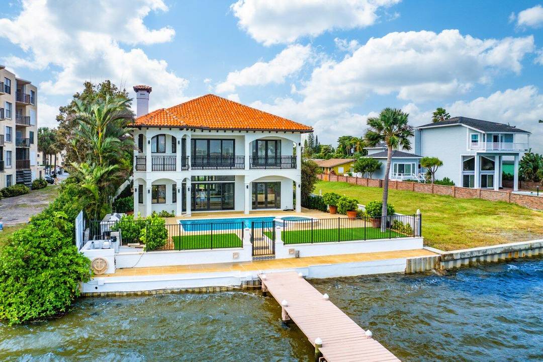 Welcome to your private gated oasis on the Intracoastal a recently remodeled waterfront residence with over 5, 000 sq ft of luxurious living space.