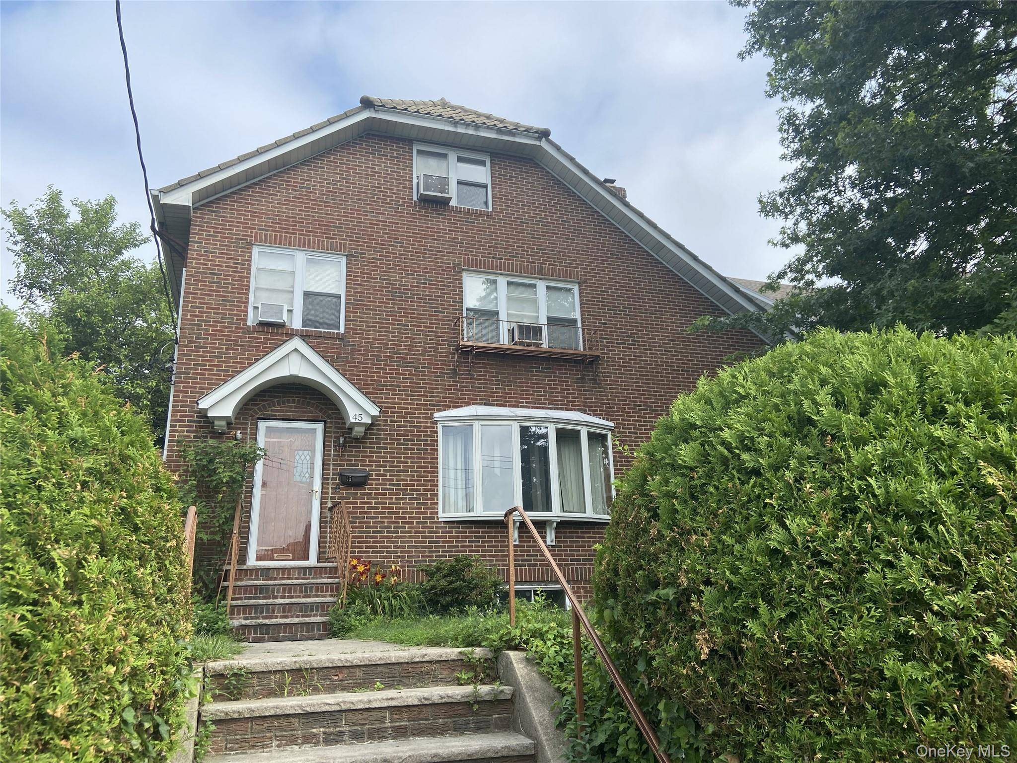 Brick Tudor home in tree lined residential area of New Rochelle conveniently located close to all of your life style needs.