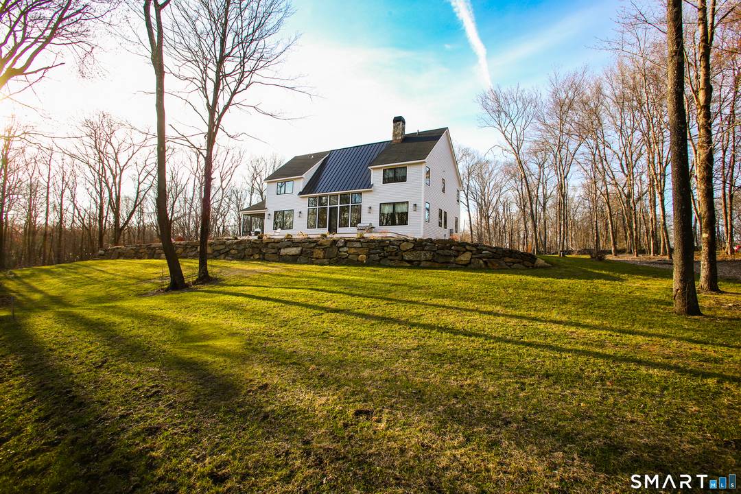 Stunning Contemporary Home in South Kent, just a year old checks all the boxes and offers quiet luxury living on 5 acres with southern exposure and a spring fed pond.