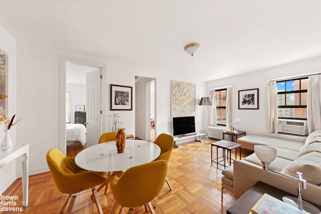 Residence 6E is a rare opportunity a top floor, corner two bedroom, one bathroom home with sweeping views of the distinctive downtown architecture and the Hudson River.