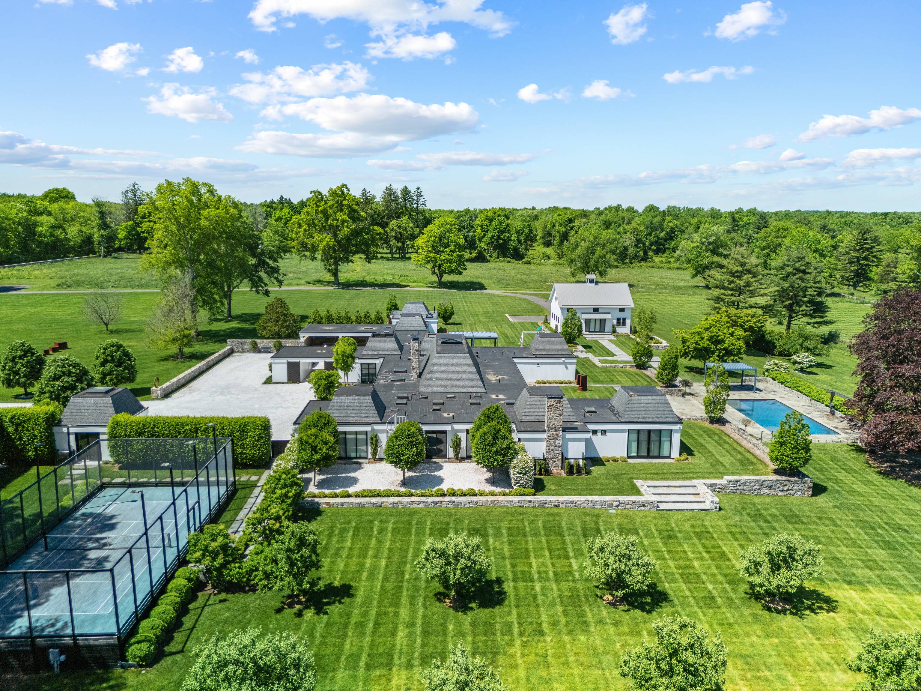 Surrounded by stone walls, this storied, spectacular and private 38.