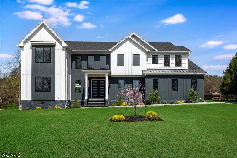 Nestled on a breathtaking private lot in desirable Warren, this extraordinary new construction modern farmhouse offers 6 bedrooms, 6.