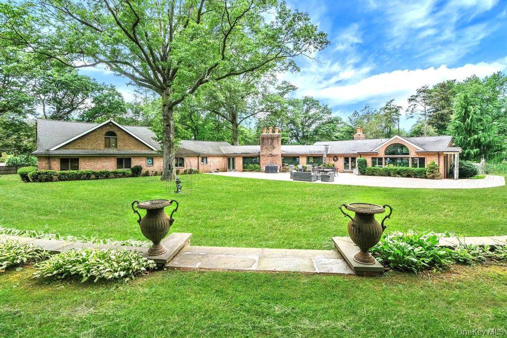 Sprawling Brick Expanded Ranch in Prestigious Old Brookville !