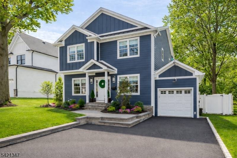 Exceptional curb appeal defines 77 Commonwealth, where a meticulously maintained property and timeless Hardie Plank siding create a striking first impression.