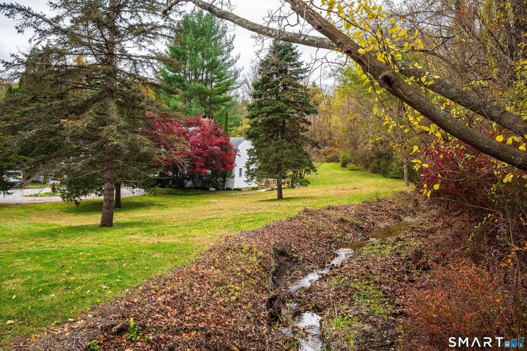 Set on a beautiful 2 acre property, this classic 4 bedroom, 2 full 1 half bath Gambrel Colonial offers classic New England charm, modern comfort, and flexible living space in ...