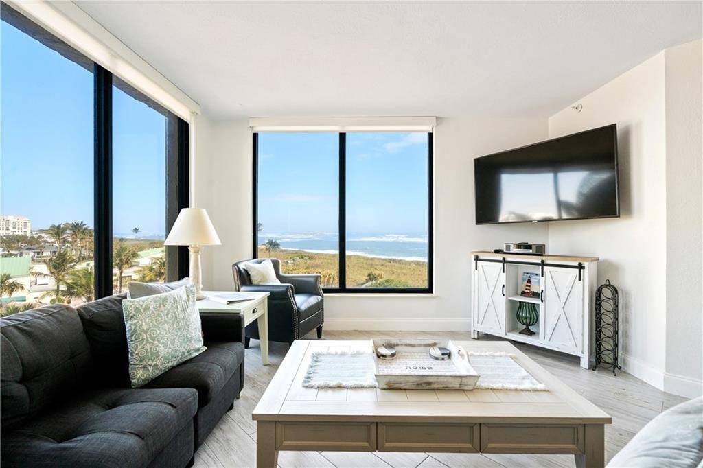 Indulge in the captivating ocean vistas and modern finishes of this corner condo.