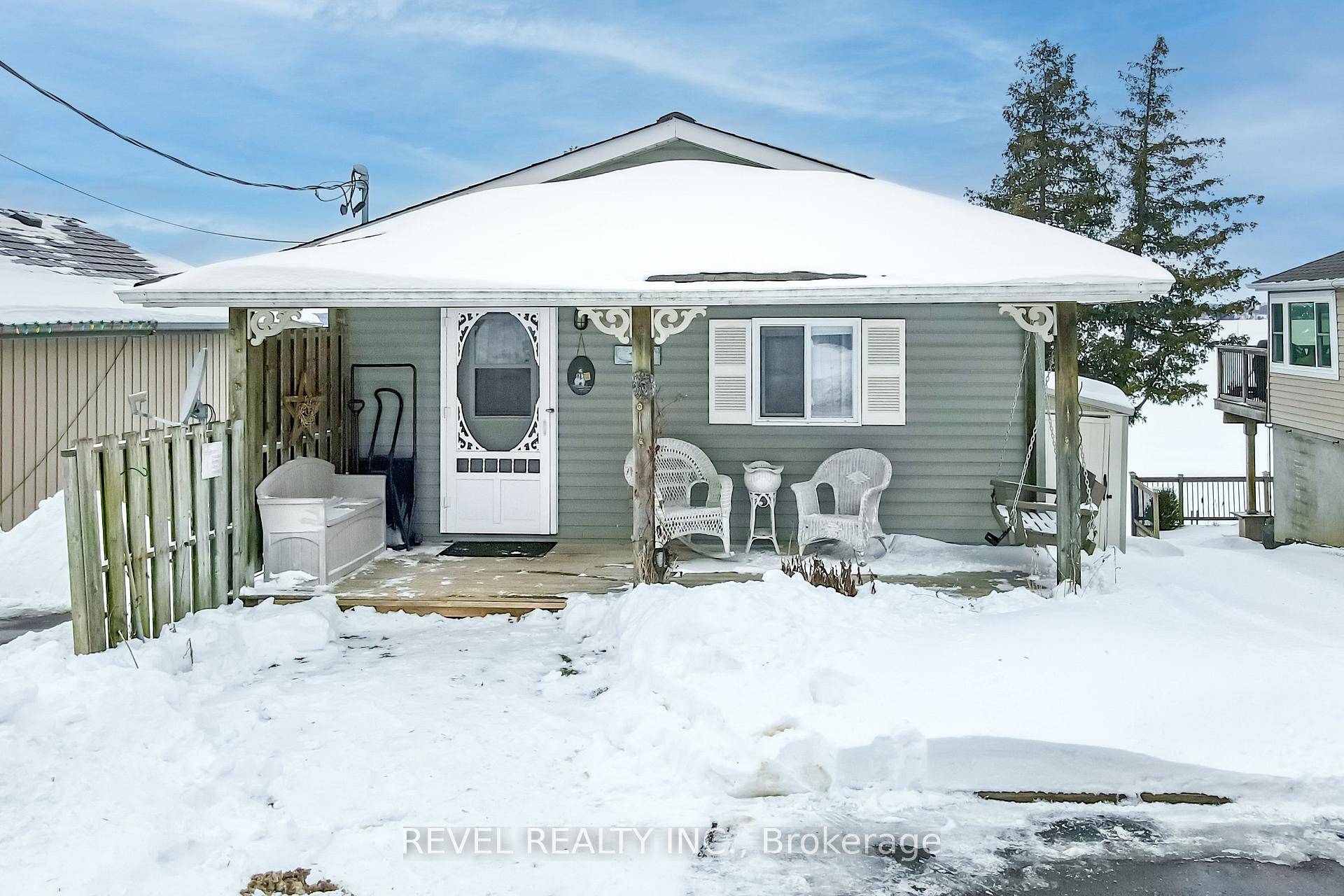 Welcome to Lake Life ! Step onto the charming covered front porch and into this inviting 2 bedroom, 1 bathroom lakefront home, perfectly nestled on the shores of Lake Scugog.