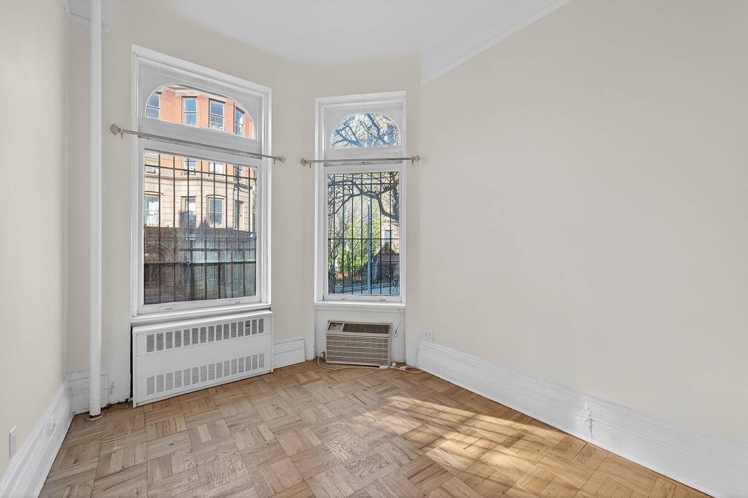 Charming newly renovated brownstone one bedroom on Central Park block and high parlor floor with tree street views.