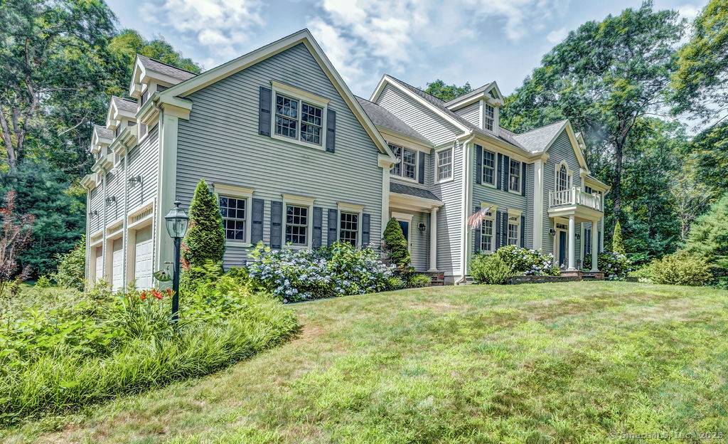 Perched above a quiet cul de sac, in one of Madison's most prestigious communities, this stately five bedroom Colonial is minutes from I 95 and Madison's Town Green and beaches.