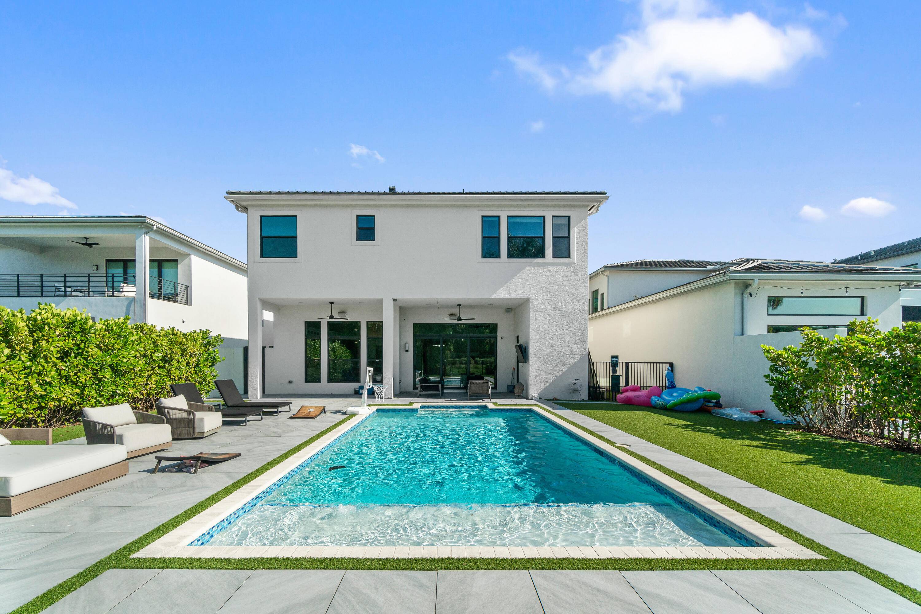 Step into refined living with this beautifully enhanced estate in the Boca Bridges.