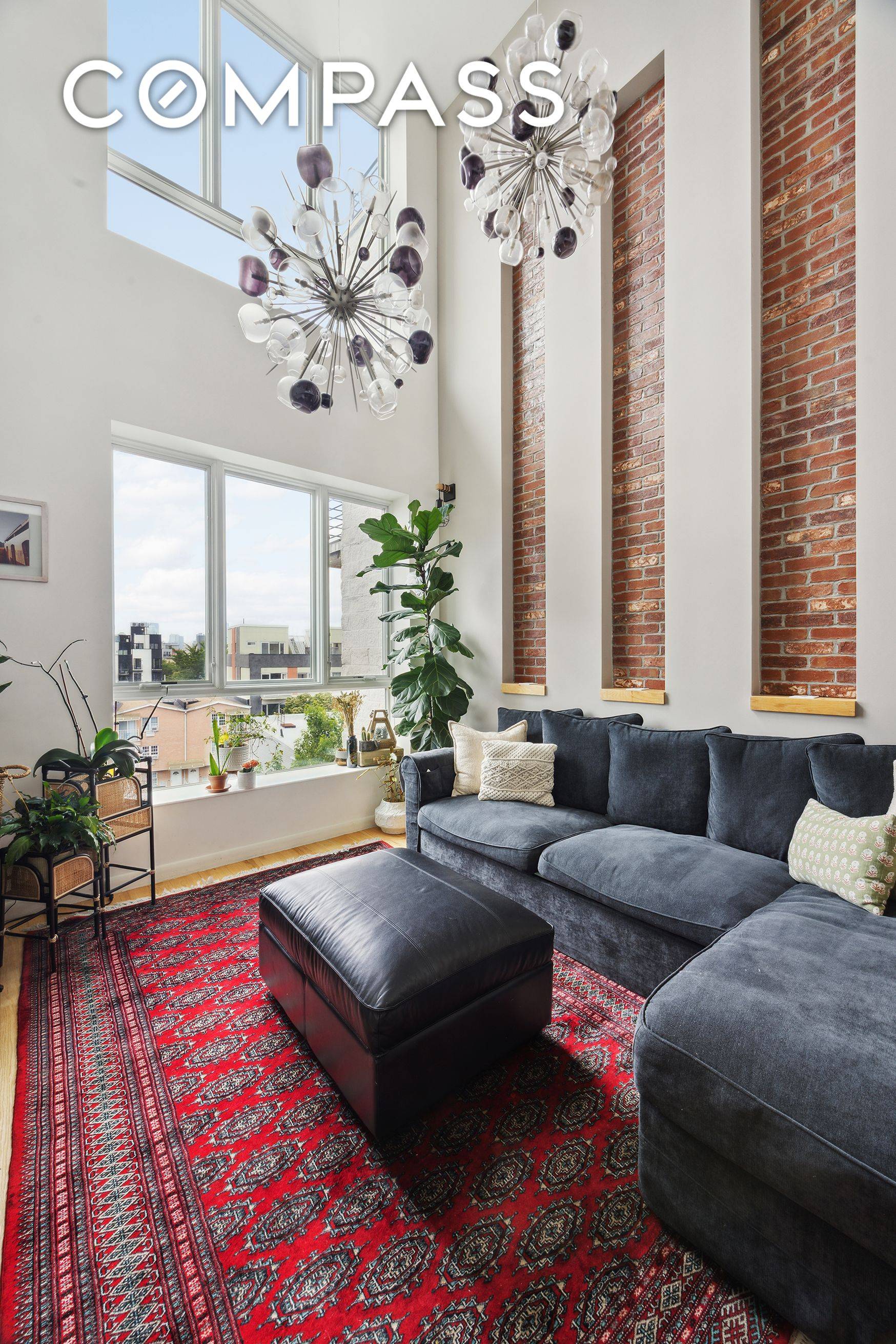 Top floor duplex in a boutique 2017 building, offering soaring double height ceilings and a rare deeded corner roof deck with sweeping skyline views.