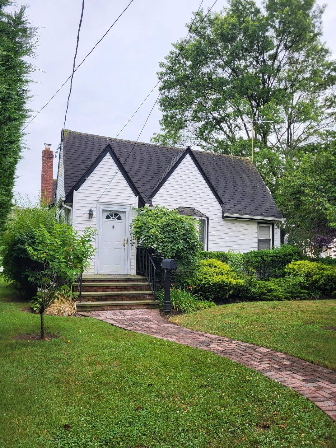 Welcome to 2 Dorothy Court in Merrick, a delightful 2 bedroom, 1 bath bungalow nestled on a peaceful cul de sac south of Merrick Road.