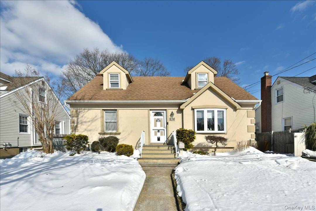 Location, Location ! Welcome to this beautifully expanded 4 bedroom, 3 bath Cape with a rear extension, perfectly situated in the heart of Merrick.