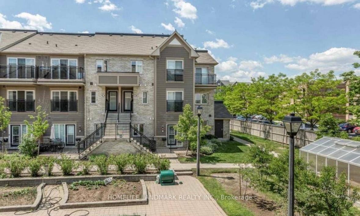 Absolutely Gorgeous ! 2 Bedrooms Townhouse Ground Level End Unit With Private Fenced Yard And Garden.