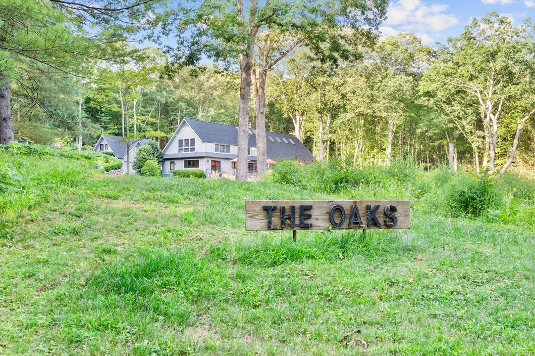 Tucked into the hills of Roxbury, this 4, 000 sq ft Mid Century Modern home is a private architectural retreat surrounded by wildflower clearings, forest, and dramatic granite outcroppings.