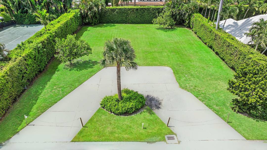254 N Woods Road presents a rare opportunity to build your dream home in Palm Beach.