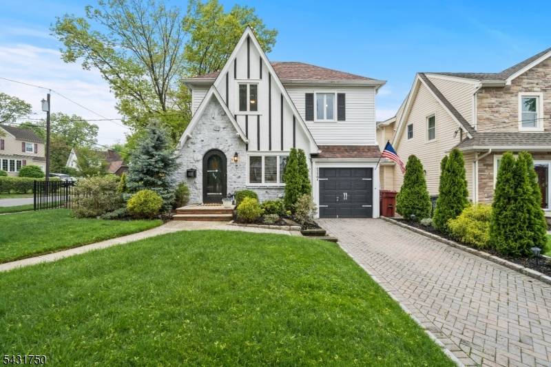 Storybook Tudor set on a corner lot in a quiet, tree lined neighborhood.