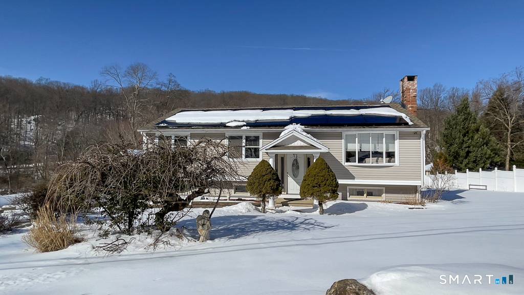 Light, bright, and updated Expanded Raised Ranch with a full solar panel system offering virtually no electric costs.