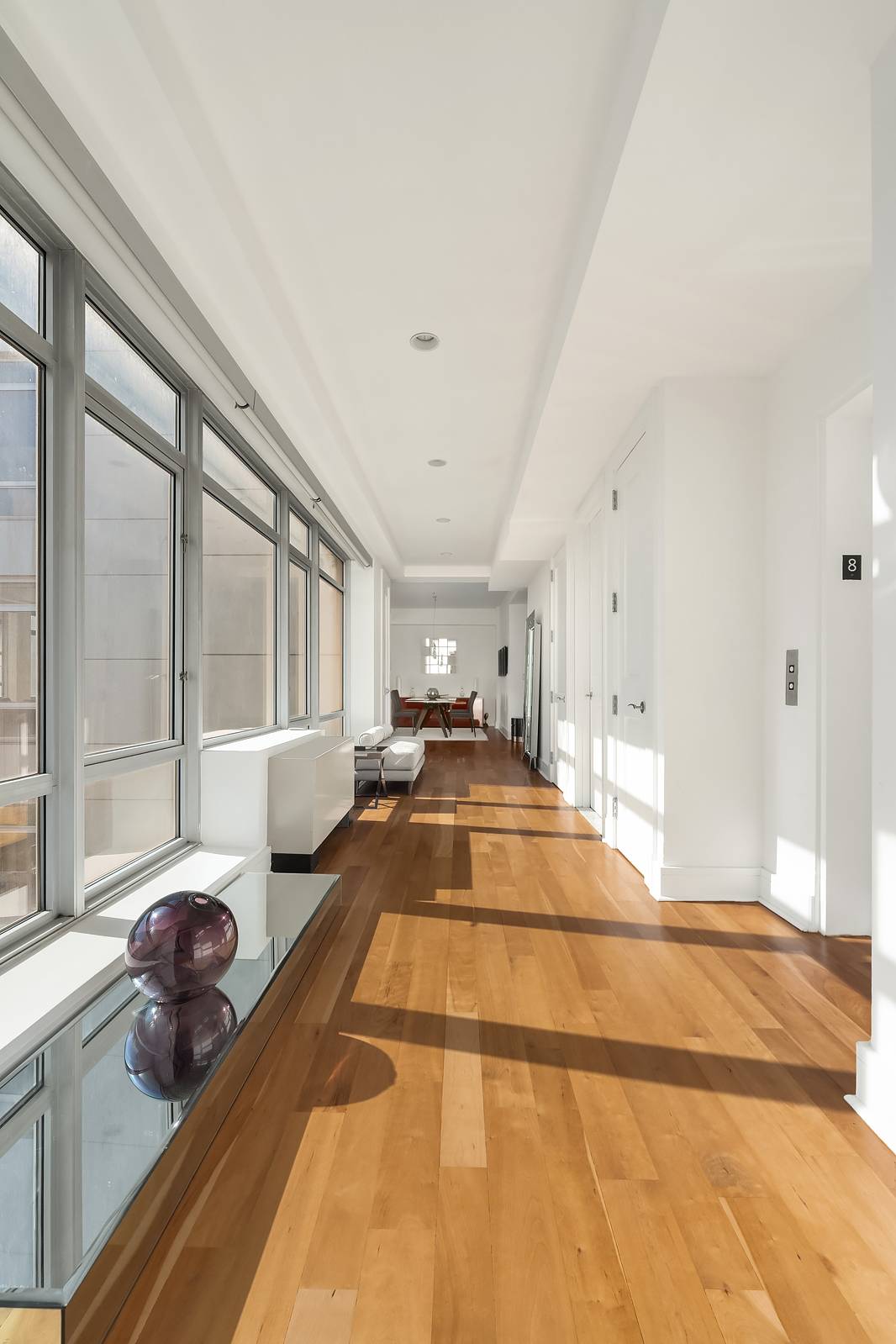 Light filled and open, this elegant three bedroom, two and a half bathroom Penthouse sits perched atop the prestigious boutique condominium building at 426 West 58th Street.