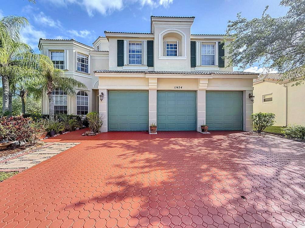 Spectacular 6 bedroom 5 and a half bath located in the exclusive Town Park at Tradition !