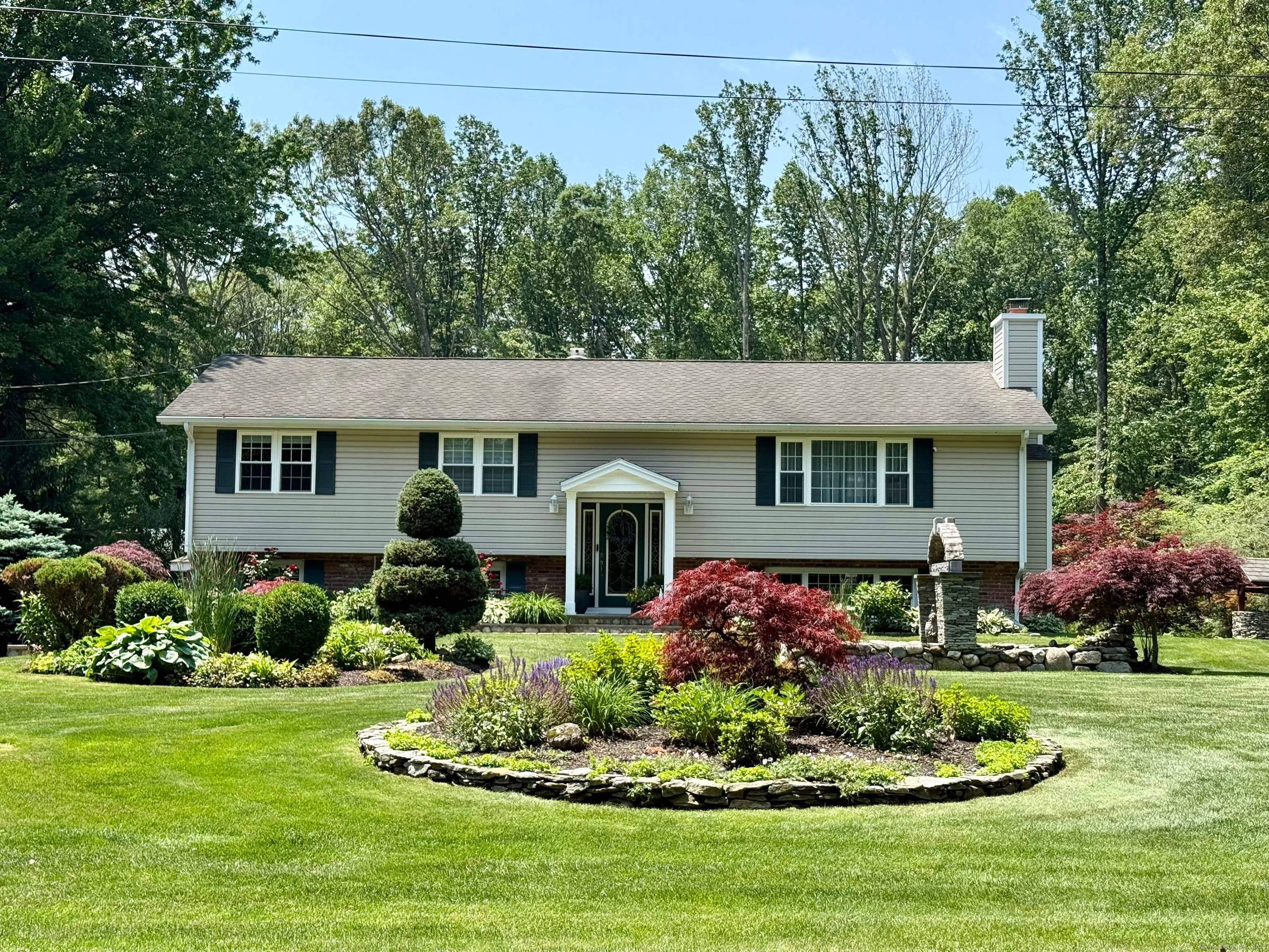 Situated on a quiet, tree lined street, beautiful raised ranch in a great Shelton neighborhood.