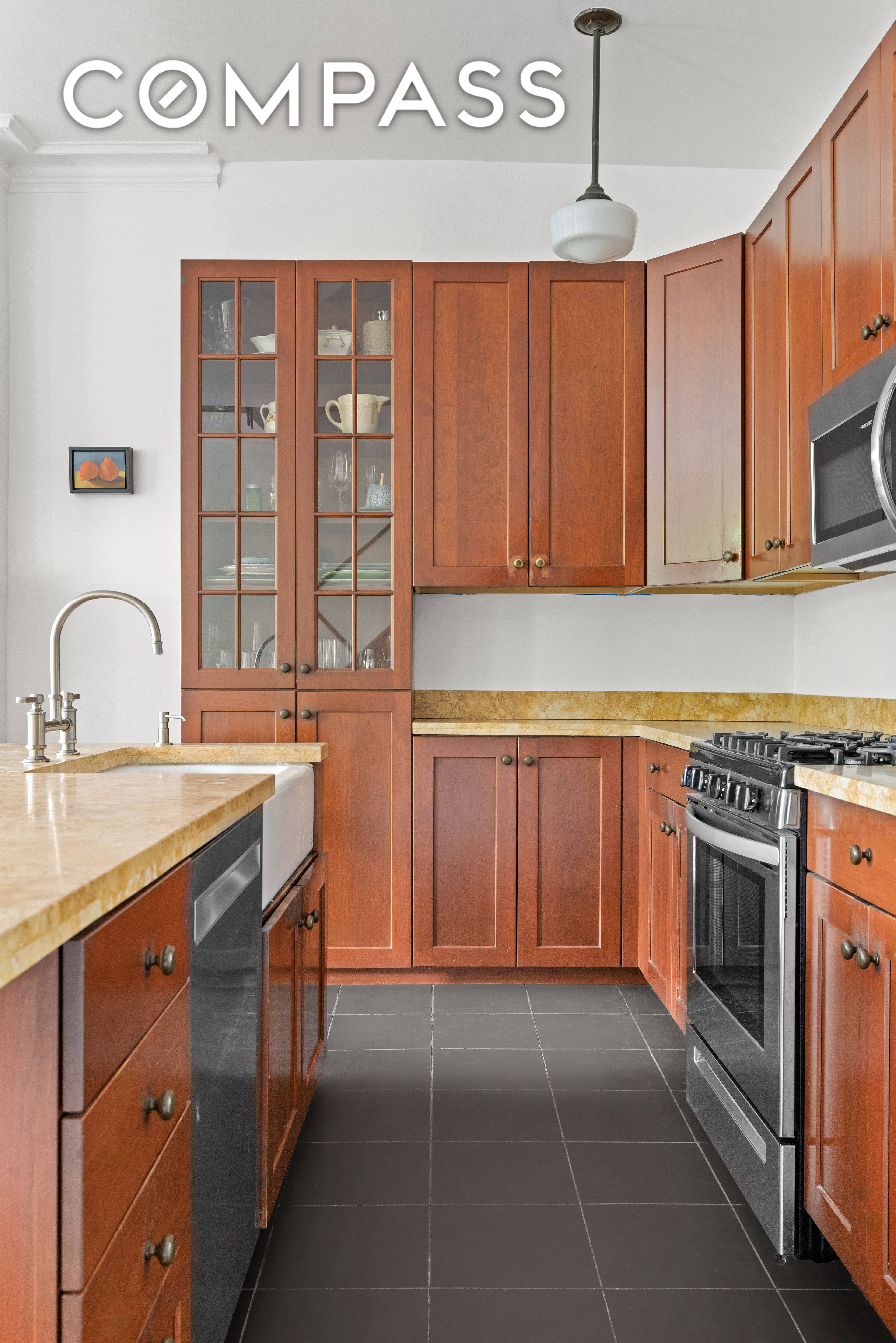 Ideally located on a picturesque, tree lined street in a stately five story brownstone, this rare 4 bedroom, 2 bath triplex is a masterful reimagining of two combined units.