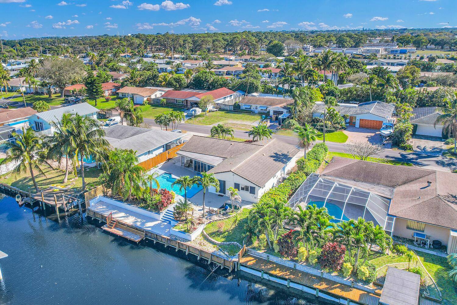 WATERFRONT Home with private pool and boat dock with canal access to Lake Ida and Lake Osborne located in the highly sought after Golf View Harbour with No HOA rules ...