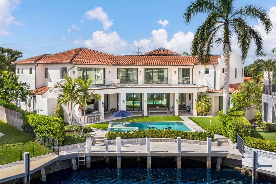 An extraordinary waterfront estate offering 8, 433 square feet of beautifully designed living space with 8 bedrooms and 9 bathrooms, inspired by timeless Spanish Mediterranean architecture.