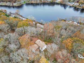 Nestled on a little over 3 acres charmed with stone walls, ponds and views of Gorton Pond !