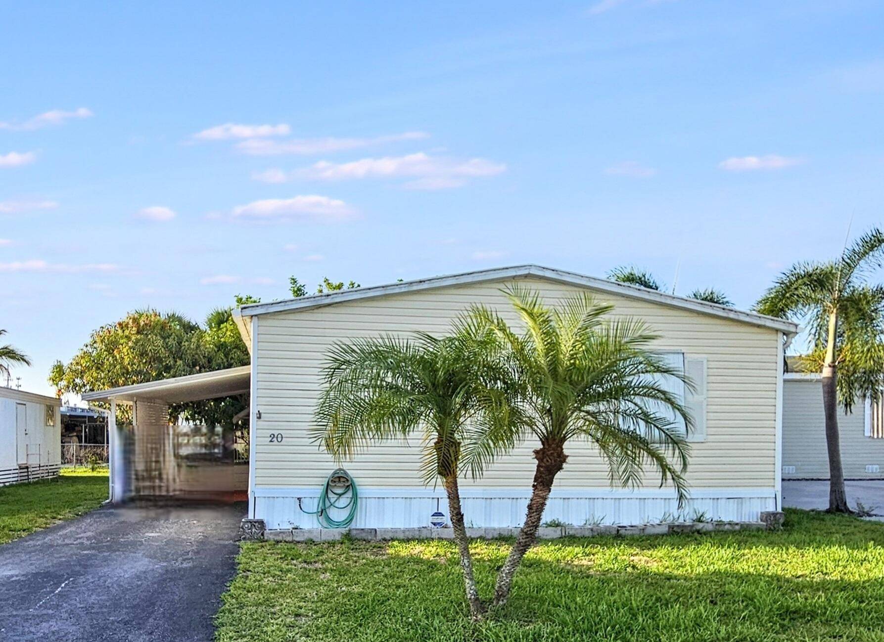 Own the land and the home in this desirable gated community !