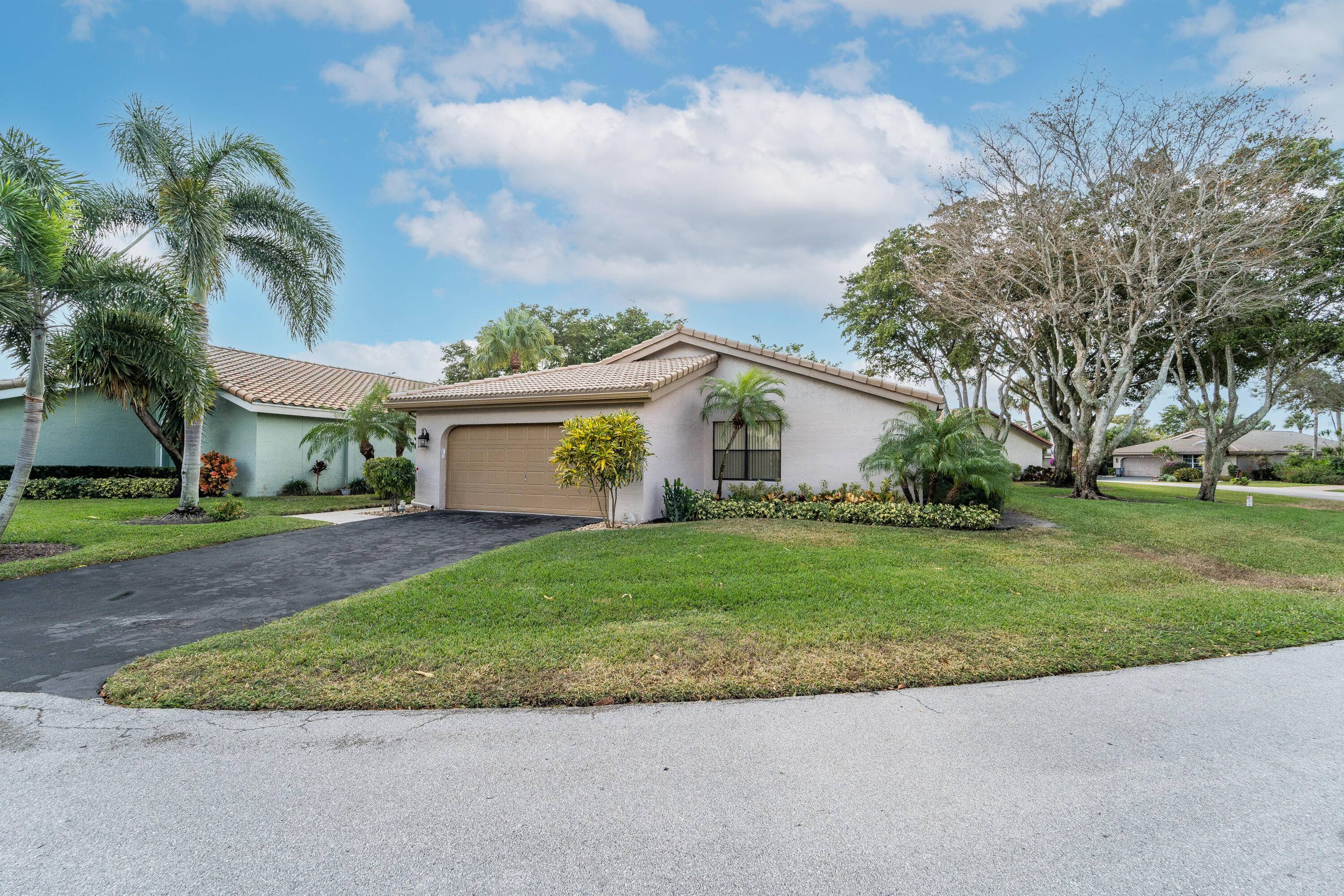 This charming and well maintained single family home sits on a desirable corner lot in the heart of Boynton Beach.
