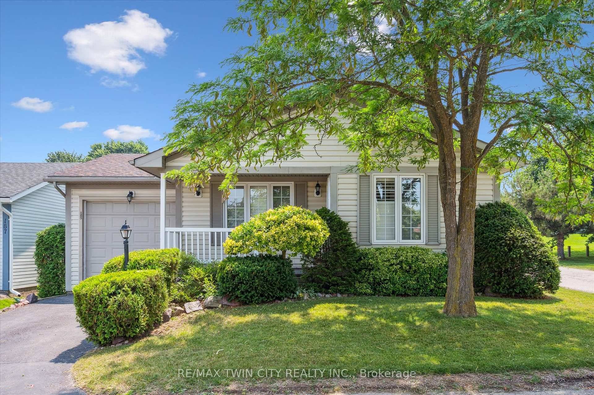 Charming BUNGALOW with attached tandem garage in sought after adult lifestyle community of Martin Grove Village.