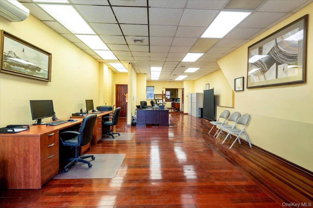 Prime mixed use property featuring a ground floor commercial storefront with excellent street visibility and two separate residential units above.