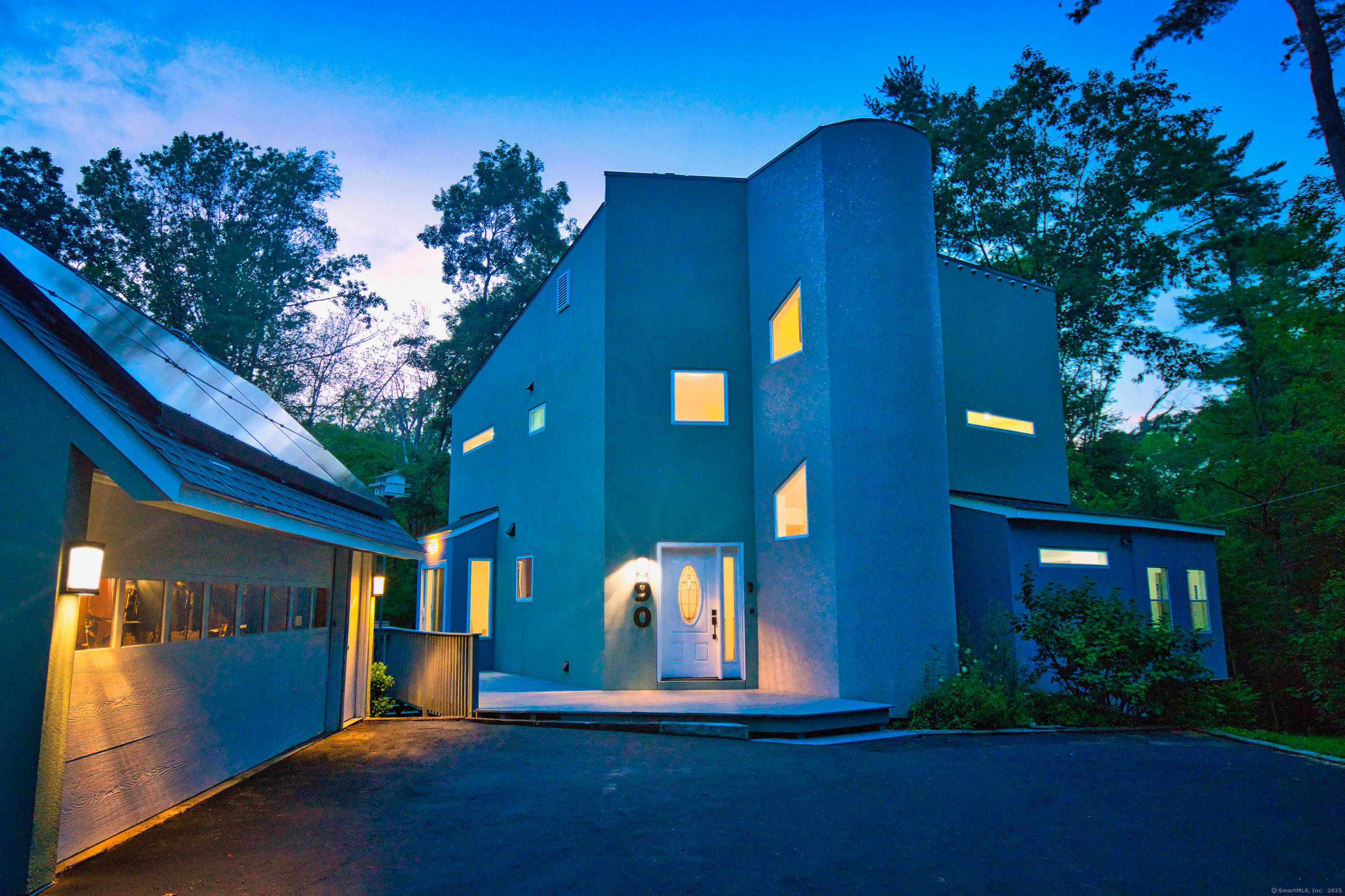 Incredible contemporary home close to the coast, directly situated on Van Wie Pond with access to Branford Land Trust.