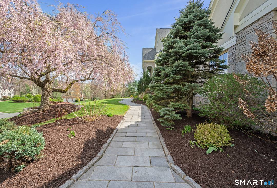 Spectacular custom home, lovingly curated, BEAUTIFULLY maintained and often admired, is set majestically on a private cul de sac in South Glastonbury's premier Kingswood Estates.