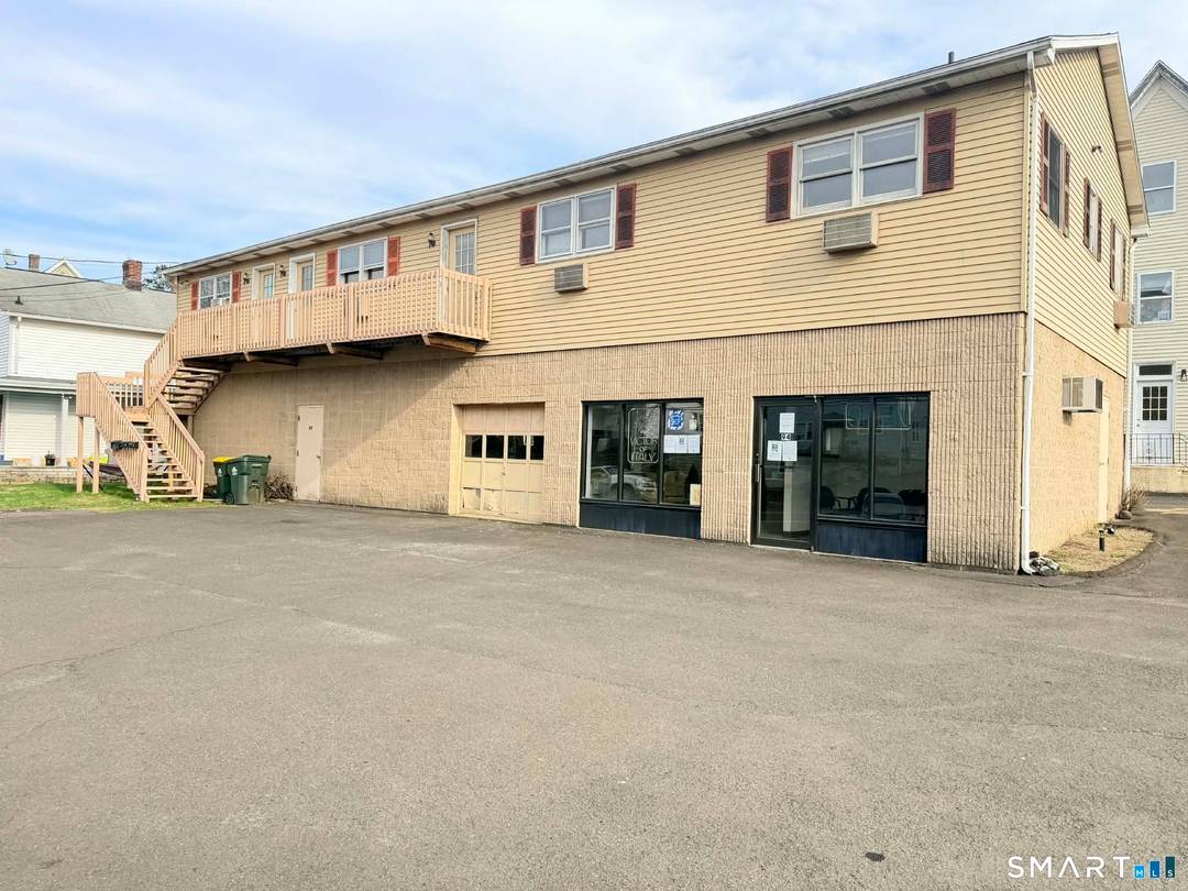 Prime Mixed Use Investment Property with 1 store and 3 apartments and large 2 car garage.