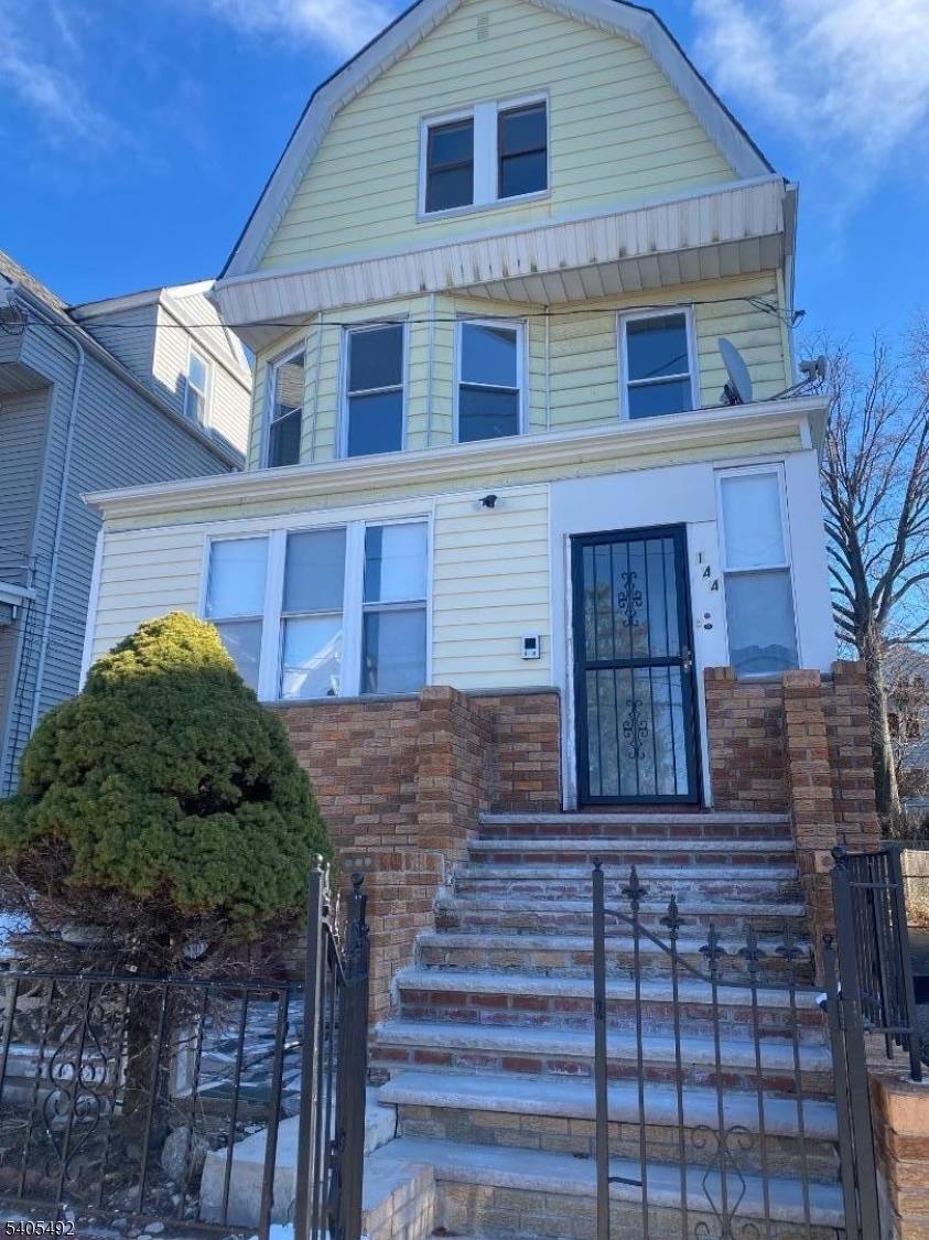 Welcome to this renovated three story multi family residence offering both character and modern convenience.