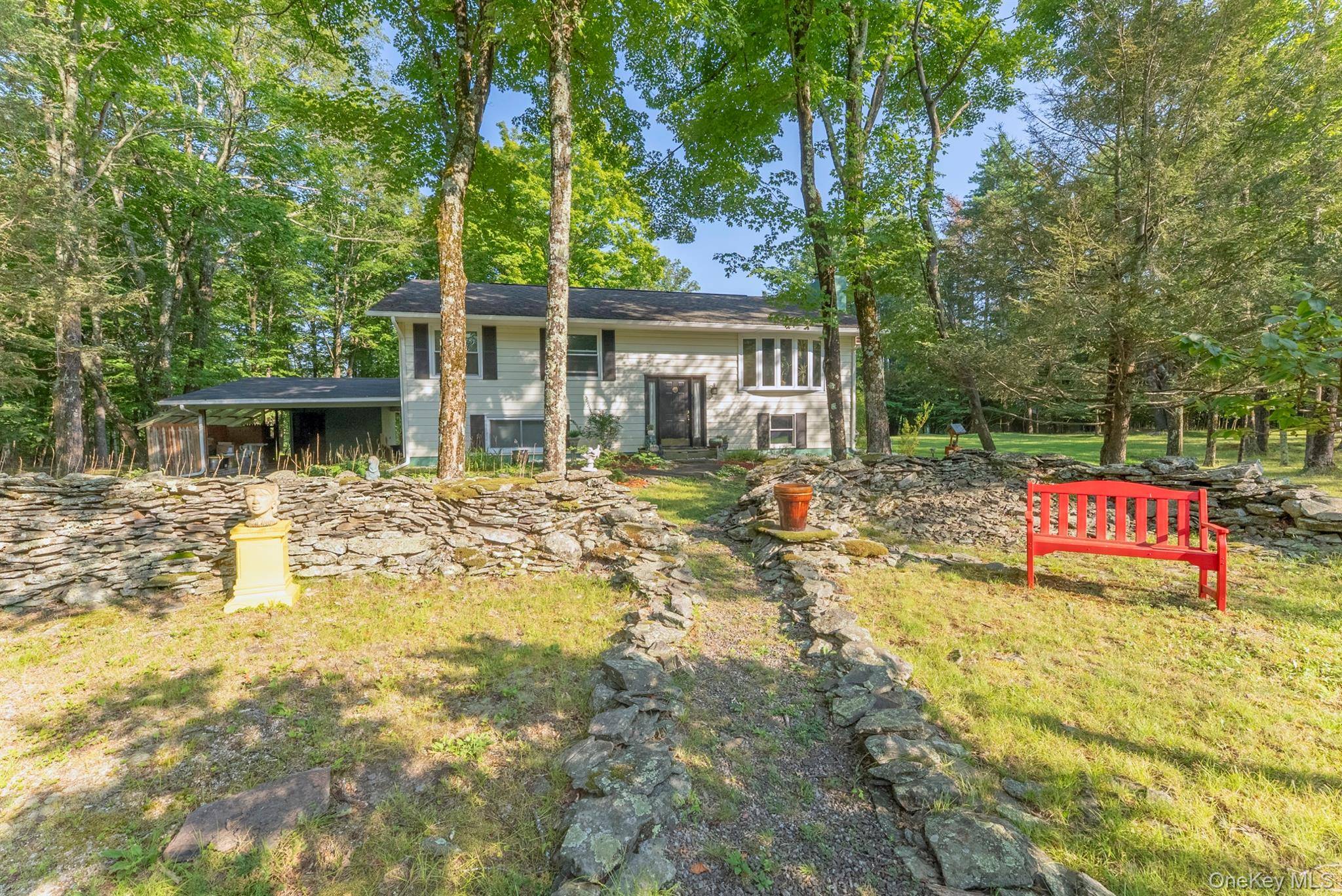 Located on a quiet, country road is this meticulously maintained raised ranch home with ample privacy.