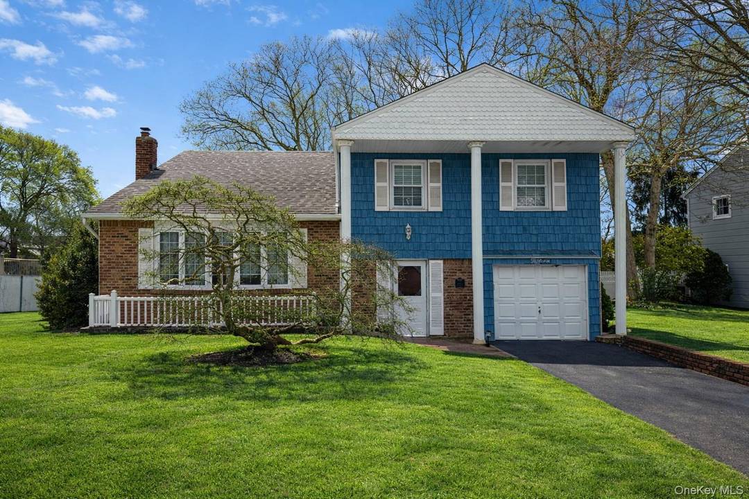 Welcome to 15 Palm St in Selden, a meticulously maintained original owner home that has been loved and cared for since 1971.