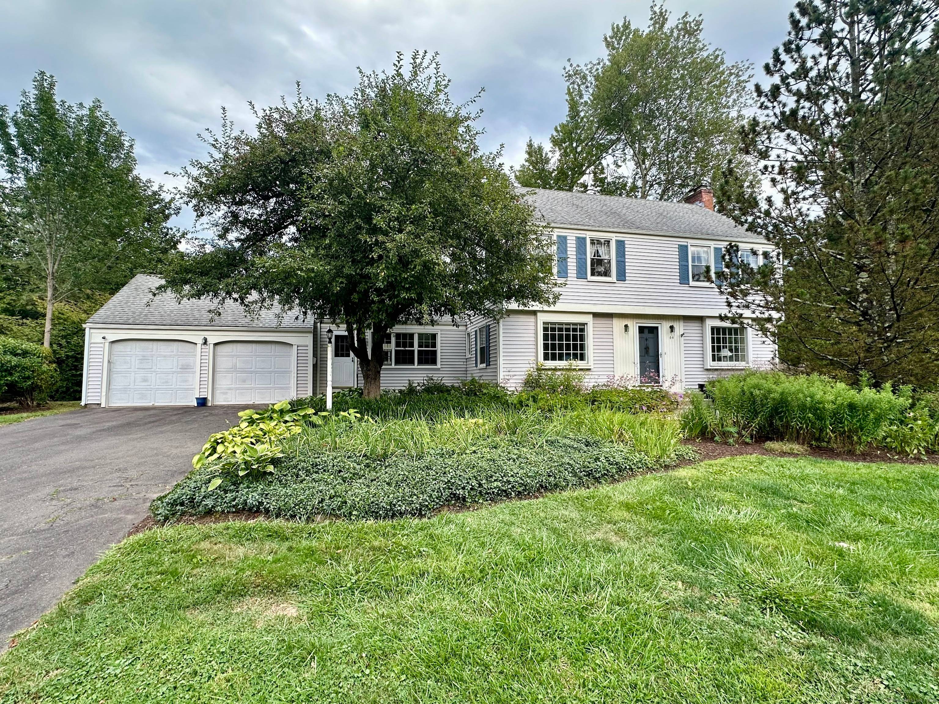 Welcome to 64 Harvest Lane, a charming Colonial on a quiet street in the highly desirable Bugbee School District.