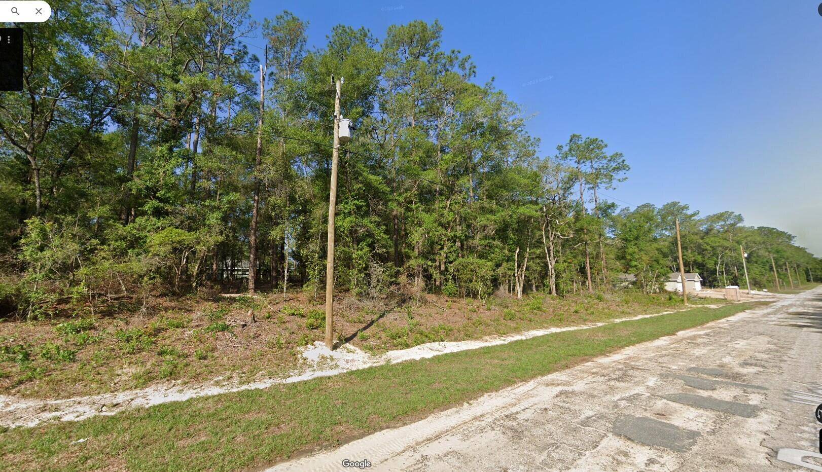 This parcel enjoys convenient access to a golf course and country club.