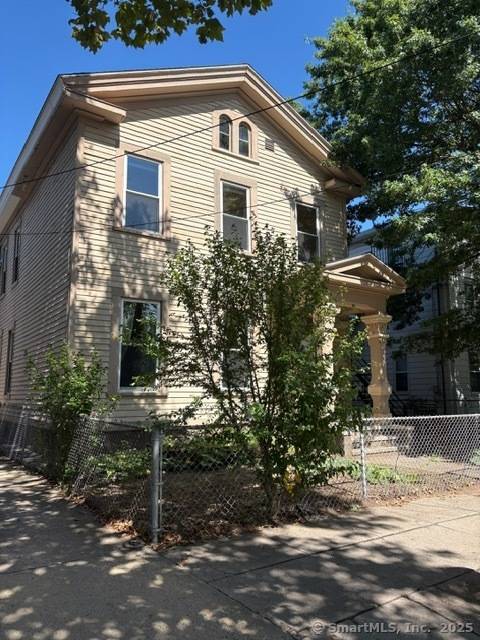 This wonderful three family is on a quiet one way street in the Wooster Square area.