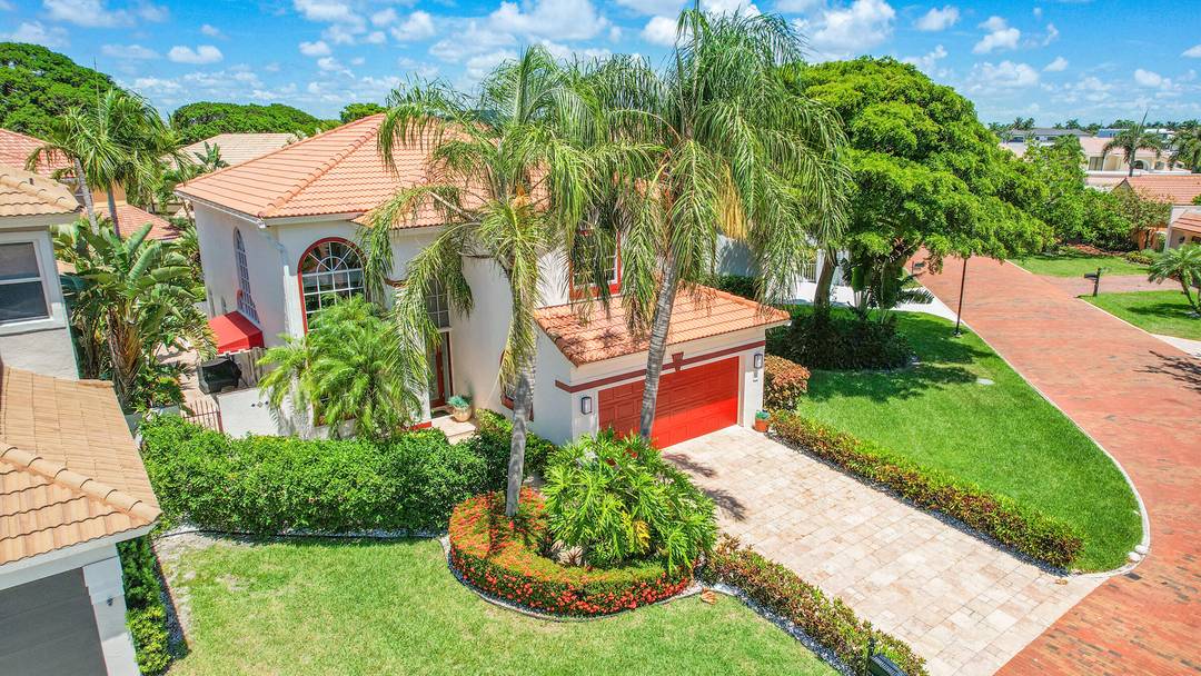 Experience coastal living at its finest at 3568 Admirals Way in Delray Beach's exclusive Pelican Harbor.