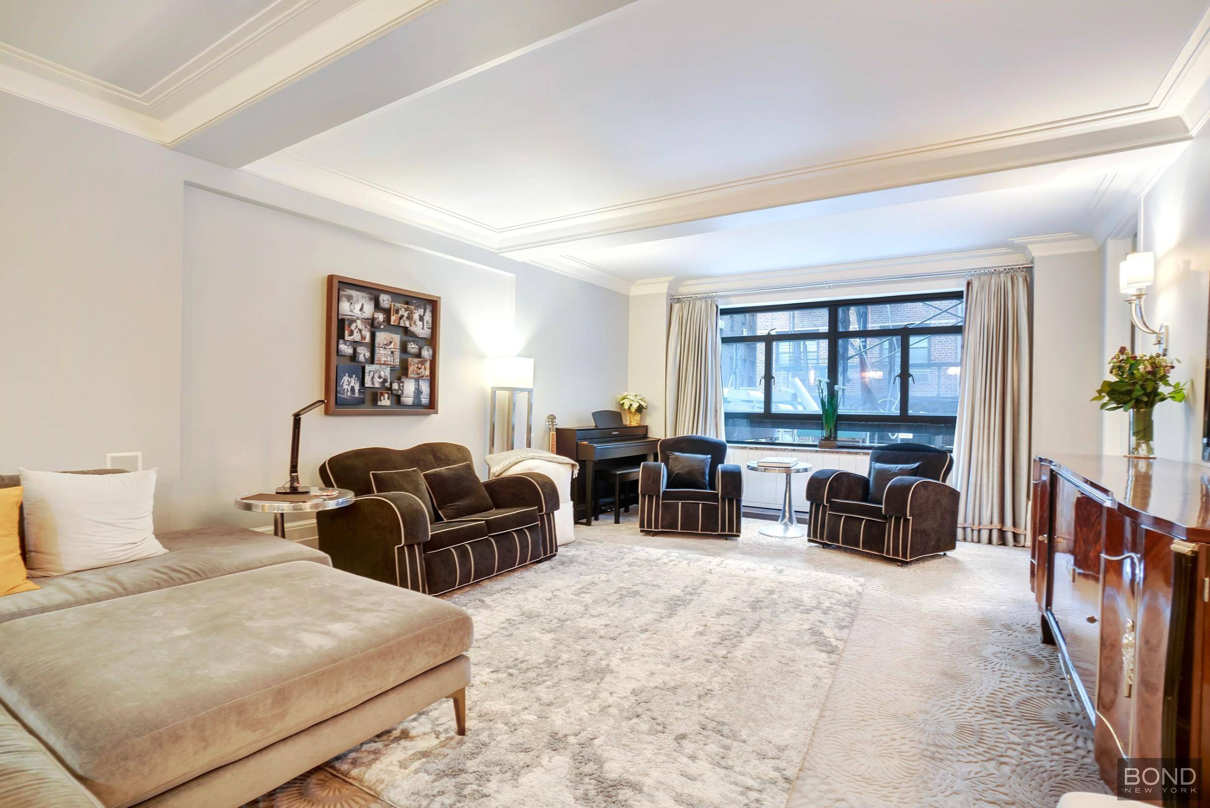 In the heart of Manhattans Carnegie Hill, this beautifully renovated two bedroom, two bathroom co op sublet home seamlessly blends historic charm with modern convenience.