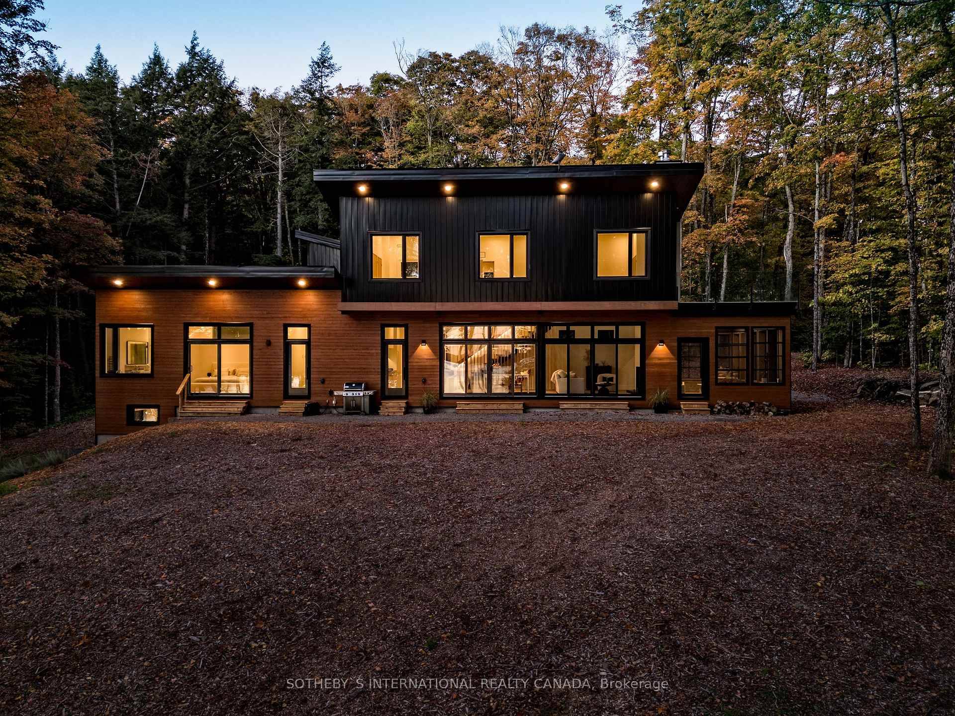 Modern Lakefront Masterpiece on Chandos Lake A rare fusion of modern luxury and mid century modern elegance, this breathtaking lakefront retreat on Chandos Lake is a masterful architectural statement.